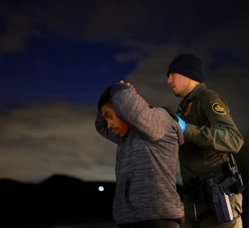 A migrant is detained by a U.S. Border Patrol agent in Sunland Park, New Mexico, on November 4, 2024. Jose Luis Gonzalez (REUTERS)