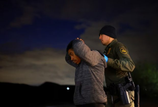 A migrant is detained by a U.S. Border Patrol agent in Sunland Park, New Mexico, on November 4, 2024. Jose Luis Gonzalez (REUTERS)