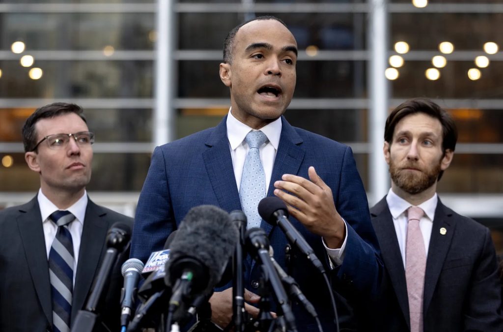 Attorney General Nick Brown, flanked by state Solicitor General Noah Purcell, left, and Assistant Attorney General Lane Polozola, speaks outside the Federal Courthouse in downtown Seattle after a judge Thursday blocked President Donald Trump’s attempt to rescind birthright citizenship. (Nick Wagner / The Seattle Times)